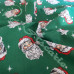 Jolly Santa Faces on Green Polycotton Print