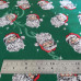 Jolly Santa Faces on Green Polycotton Print